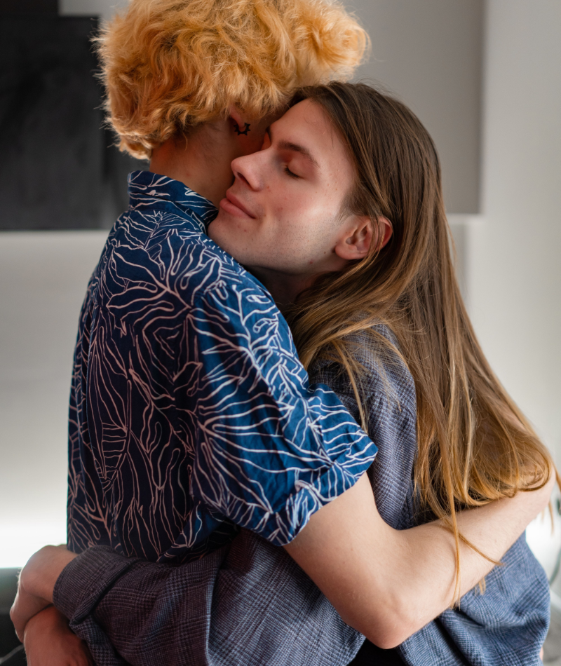 trans couple warm embrace